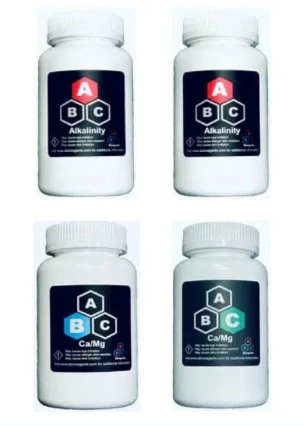 Four bottles of CoralVue ABC Reagents 2-month Supply reagent kit for alkalinity, calcium, and magnesium testing in aquariums.